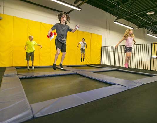 Children jumping on an indoor trampoline, Allstars Indoor Playland Edmonton
